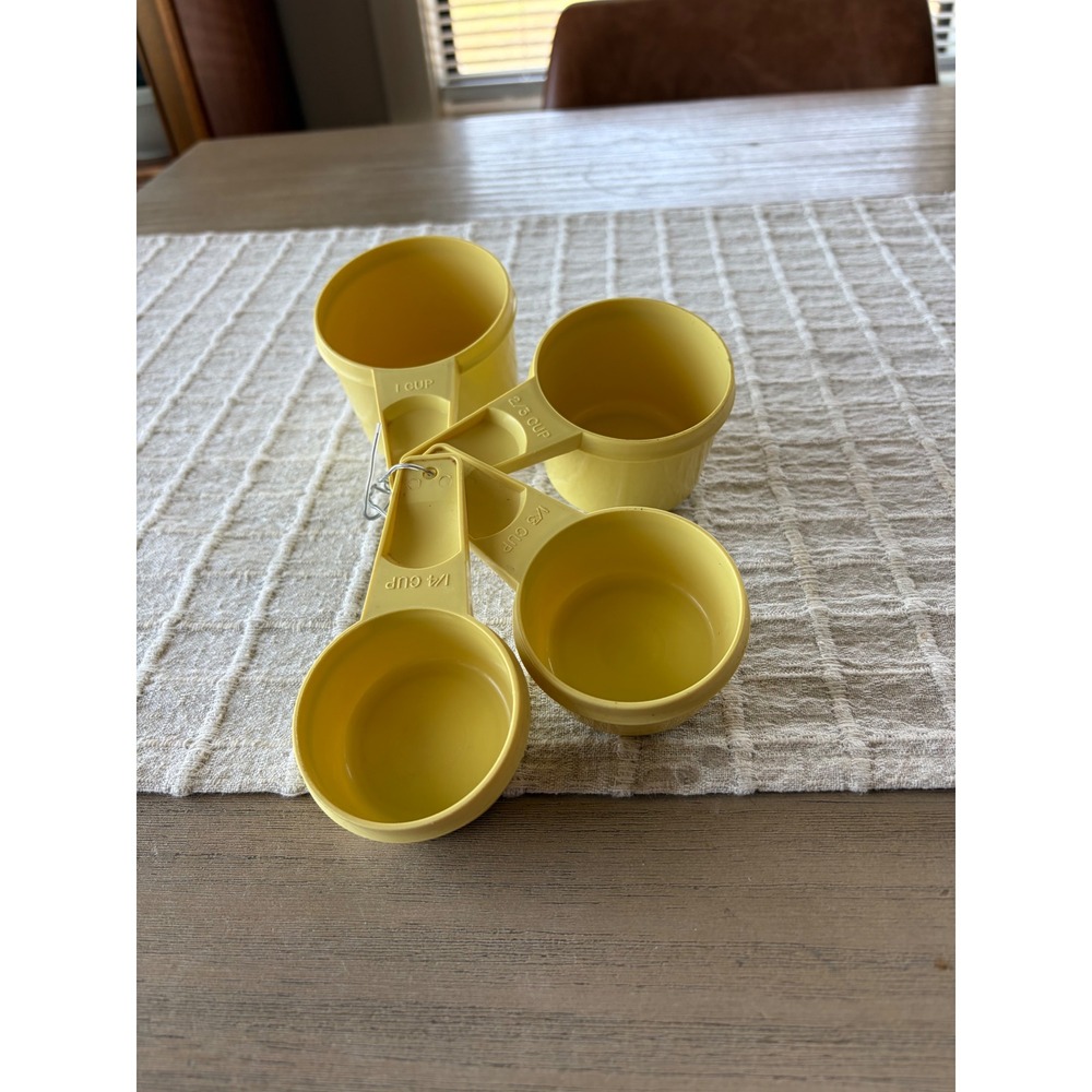 Vintage yellow Tupperware measuring cup set of 4